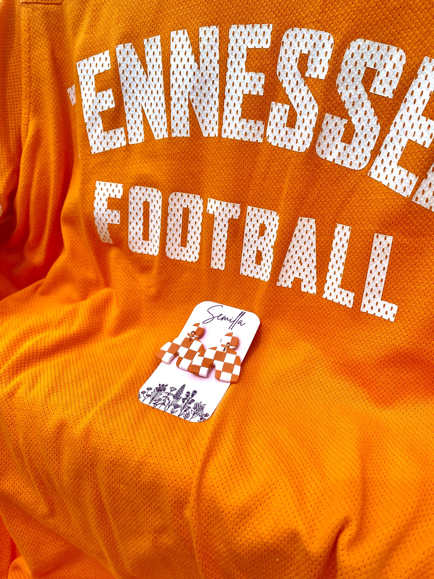 Eva in Orange and White Checkers